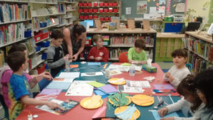 Children doing arts and crafts at the library